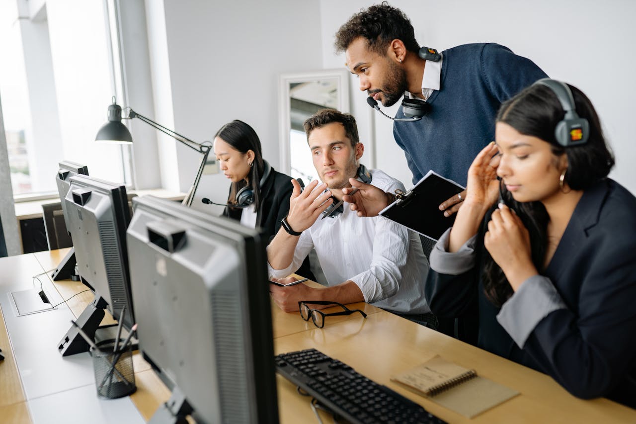 A diverse team of call center agents collaborating in a modern office environment.